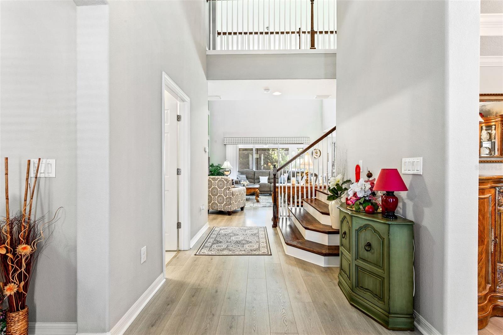 Enter into this two story entryway with ample natural light.