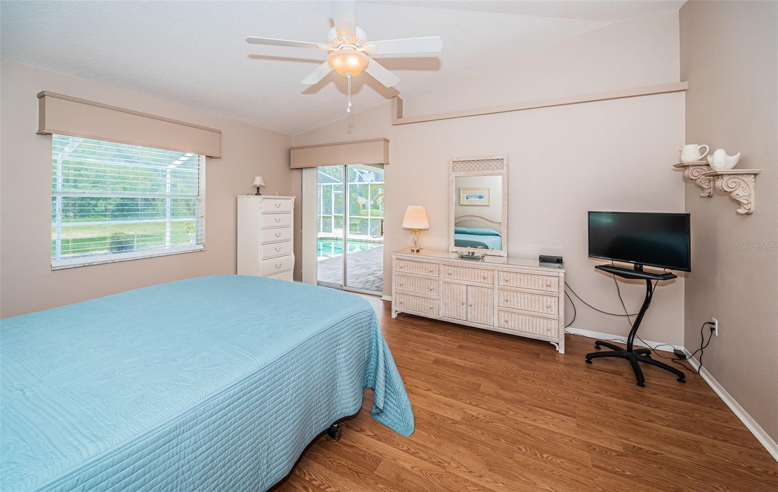 Primary Suite - sliding glass doors to the pool