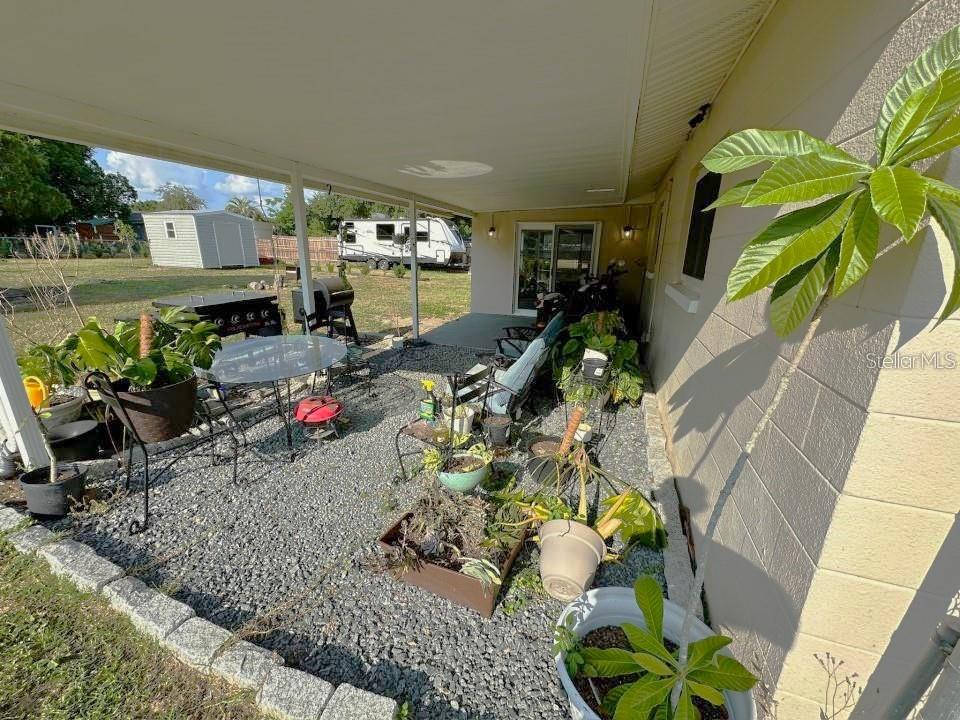 Covered Carport and Rear Porch Area