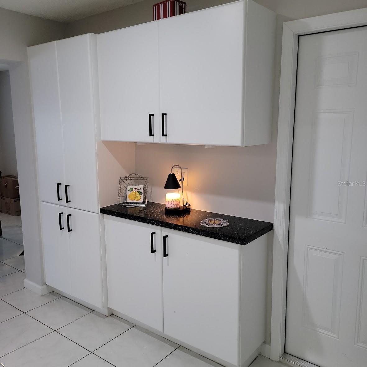 This additional pantry area / coffee station will be sure to please.