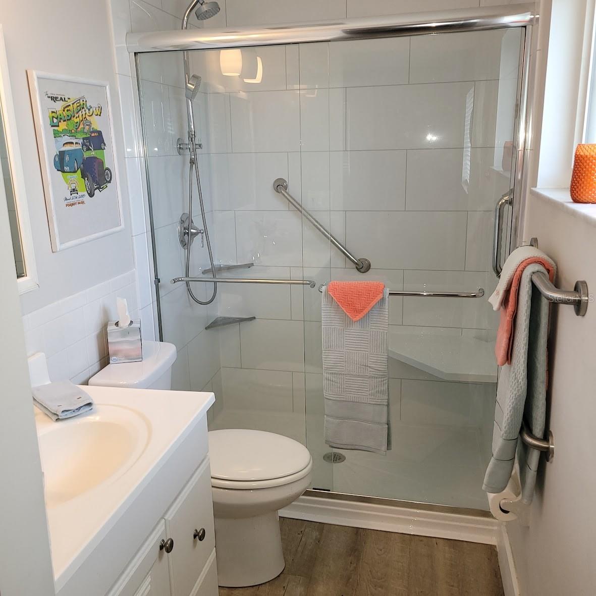 The bathroom shower was made to be safe with the grab bars.