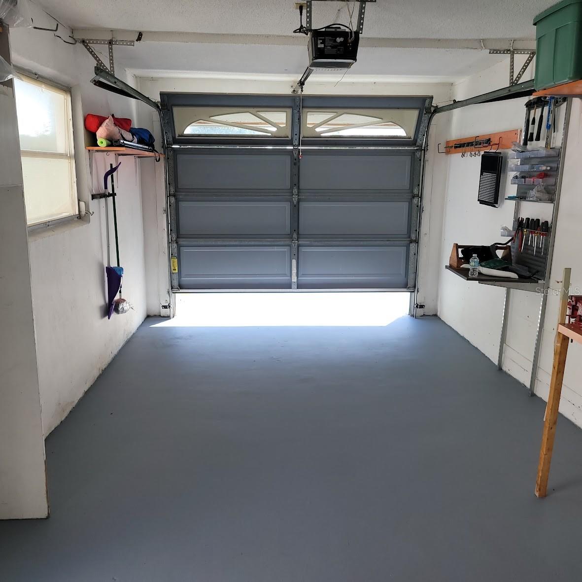 Freshly painted garage and driveway (not shown).