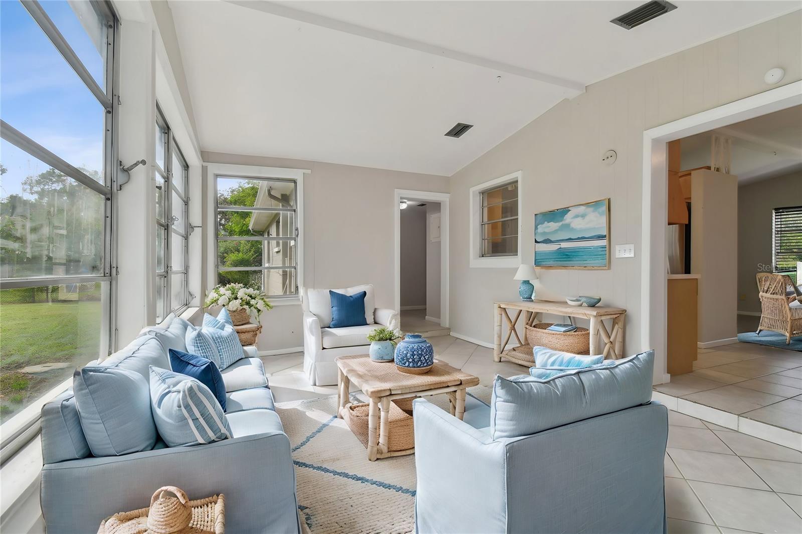 Family room with lots of natural light overlooking backyard