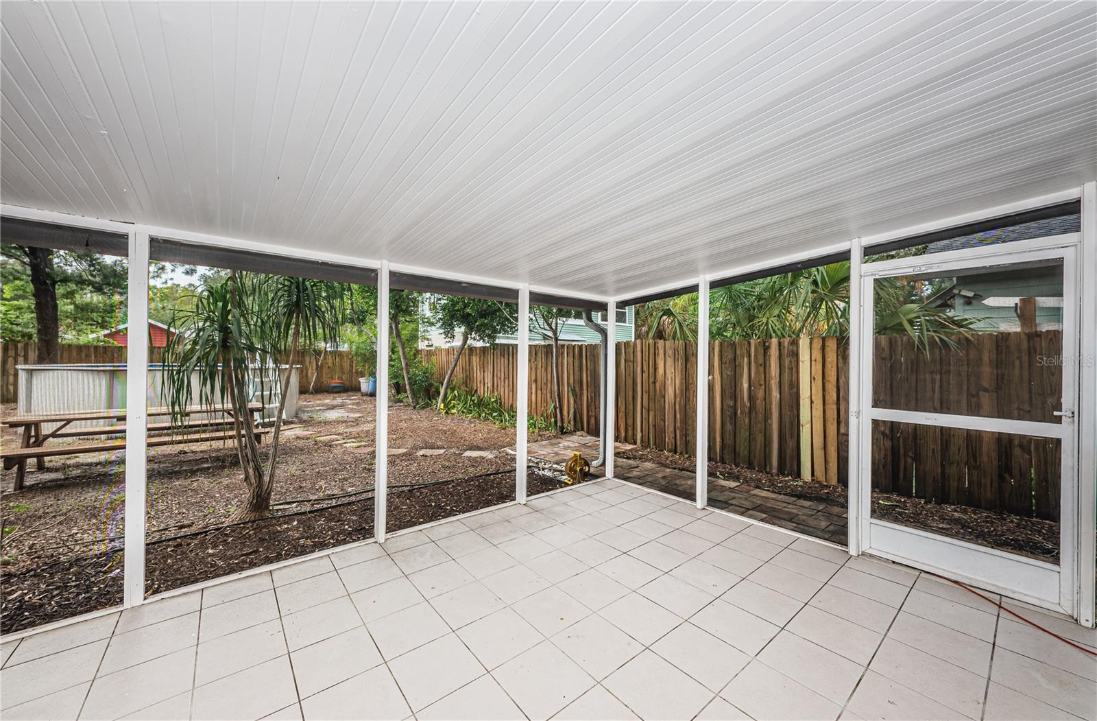 A view of the screened patio and back yard