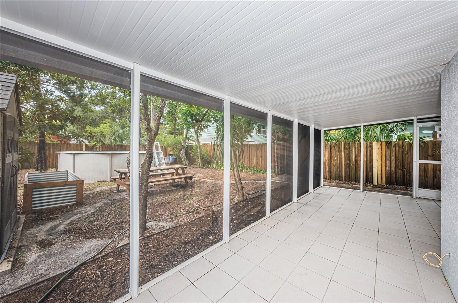 A view of the screened patio and back yard