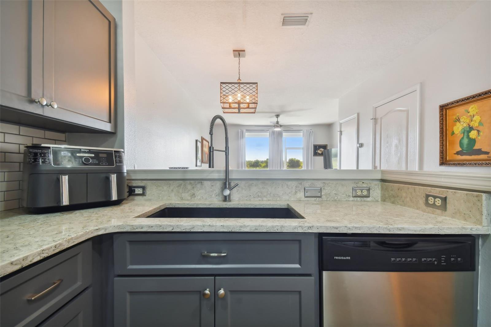 Beautiful granite countertops and single basin sink