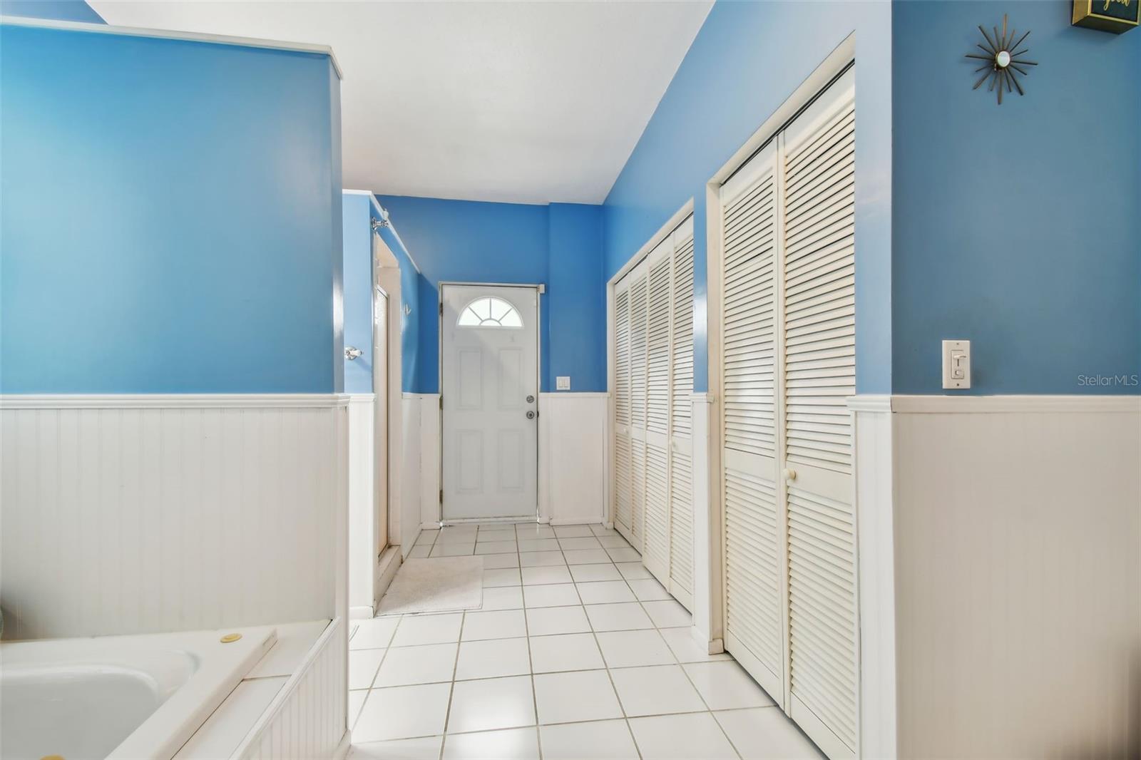 Laundry closet and separate entrance from the backyard