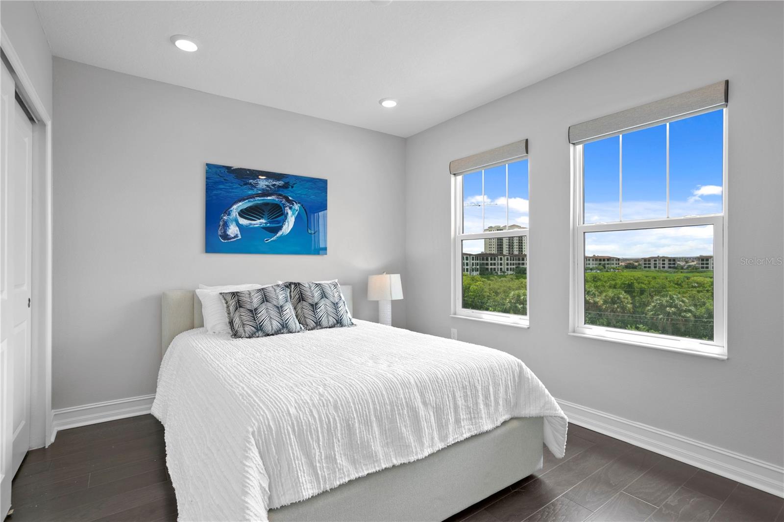 Guest bedroom with water views and custom closet