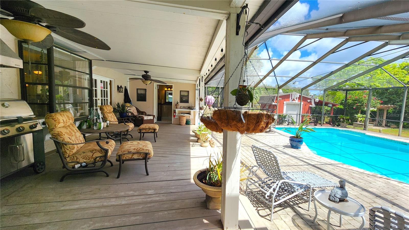 Another view of the rear deck.  There is also an outdoor full bathroom to keep the wet feet from the pool outside.