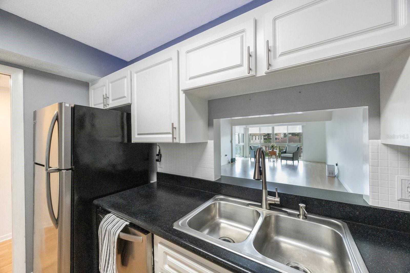 Kitchen with view of the dining and living area