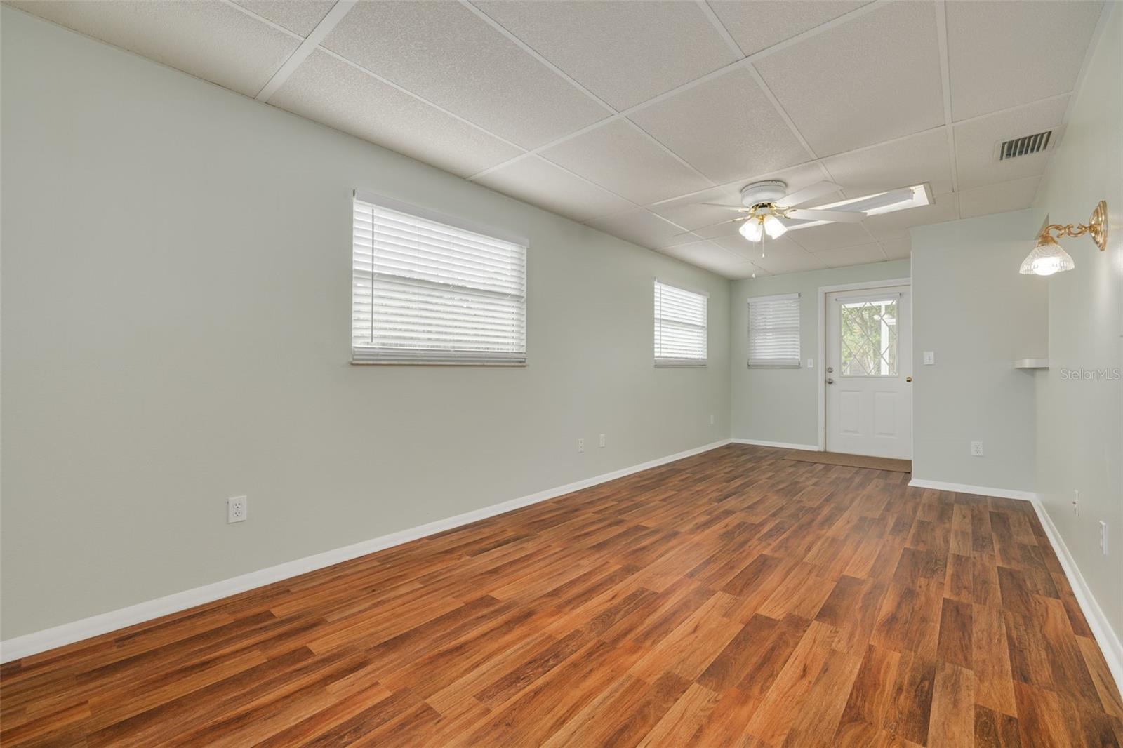 Florida room with door going out to screened lanai