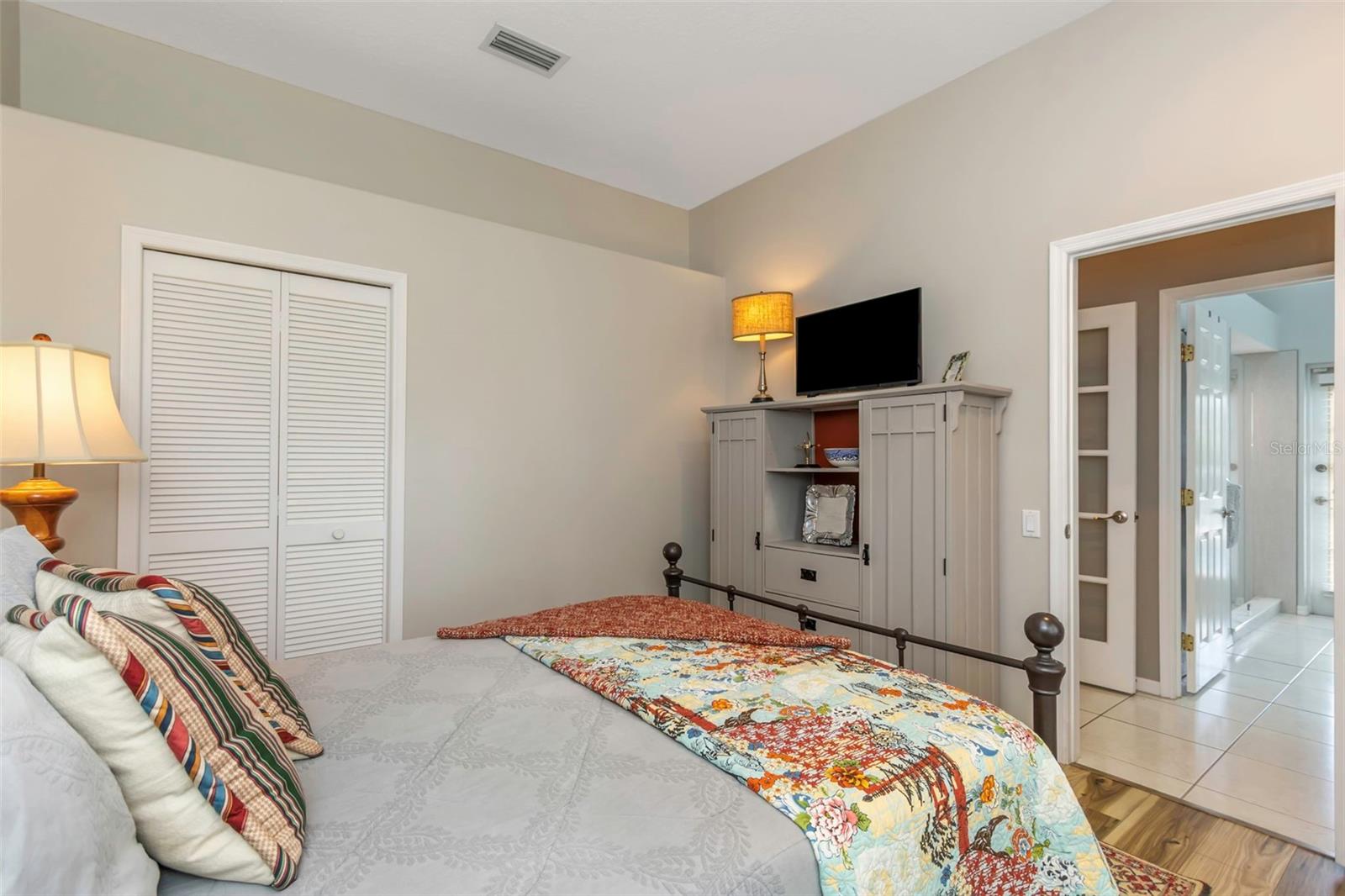 Bedroom 4 is located at the rear of the home and connects to the full pool bath.