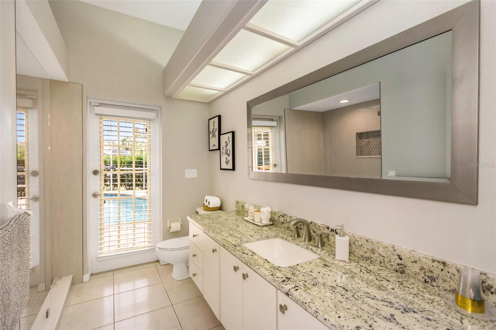 Pool bath includes a walk-in shower.