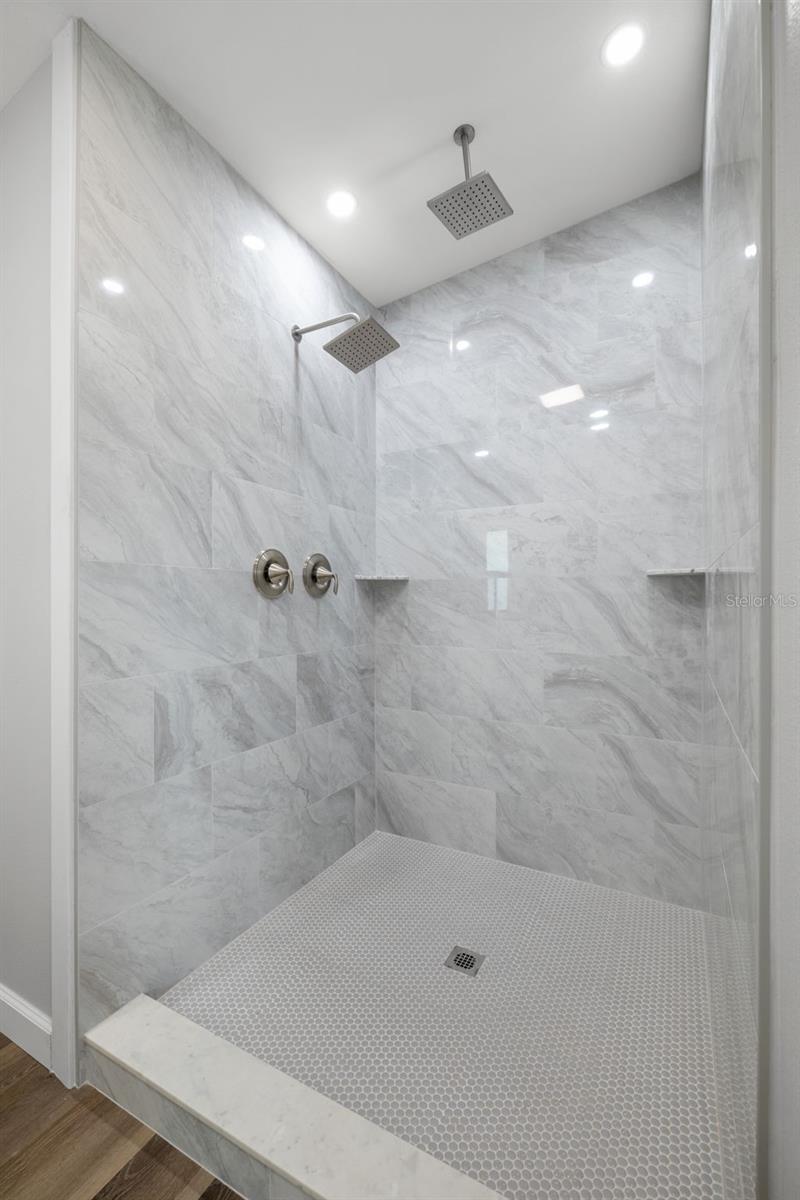 This is your DREAM shower! EX-LARGE, custom tiled shower with dual rain shower heads!