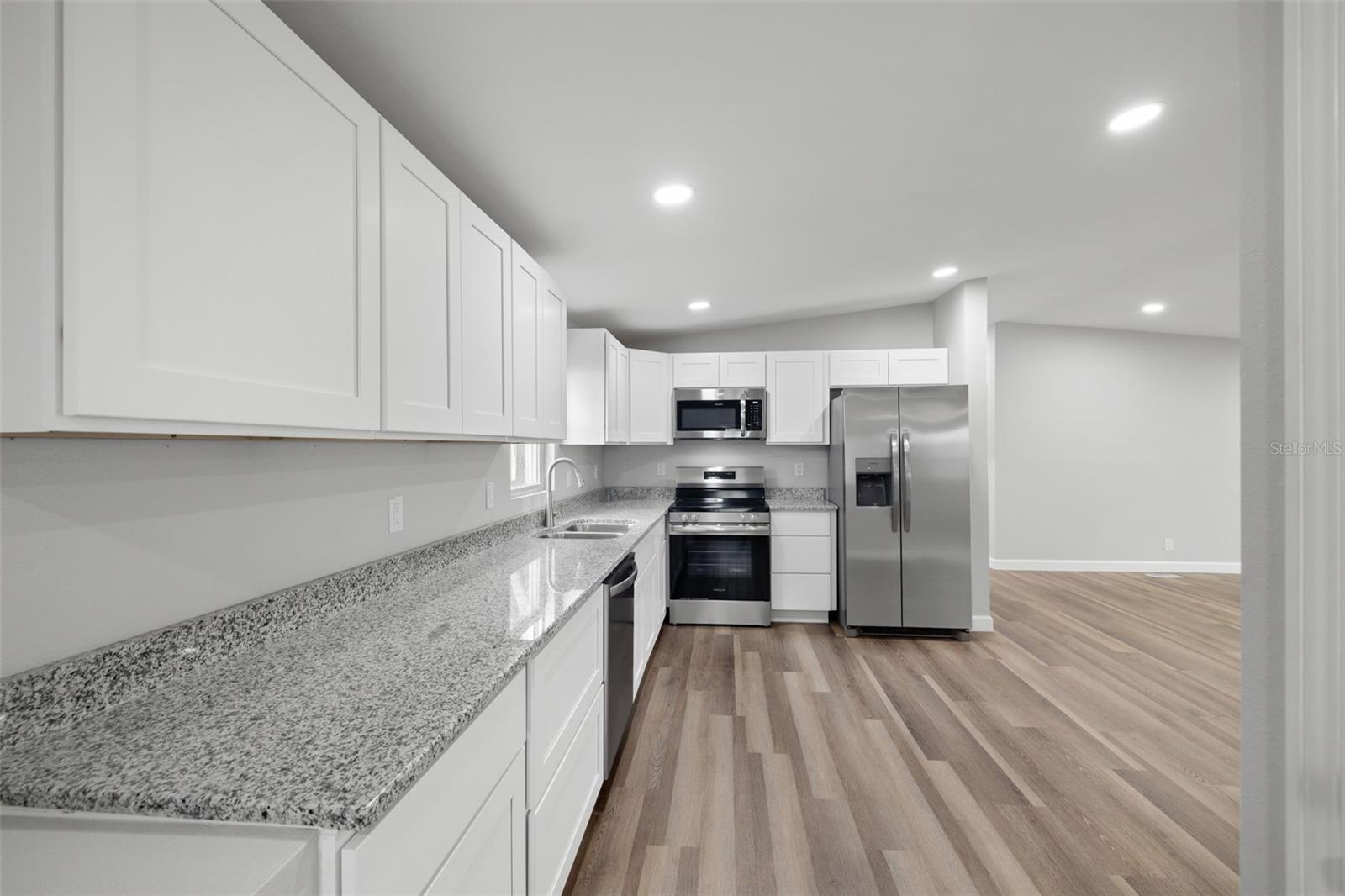 Completely renovated down to the studs!  Brand new EVERYTHING!  View from entry toward kitchen.