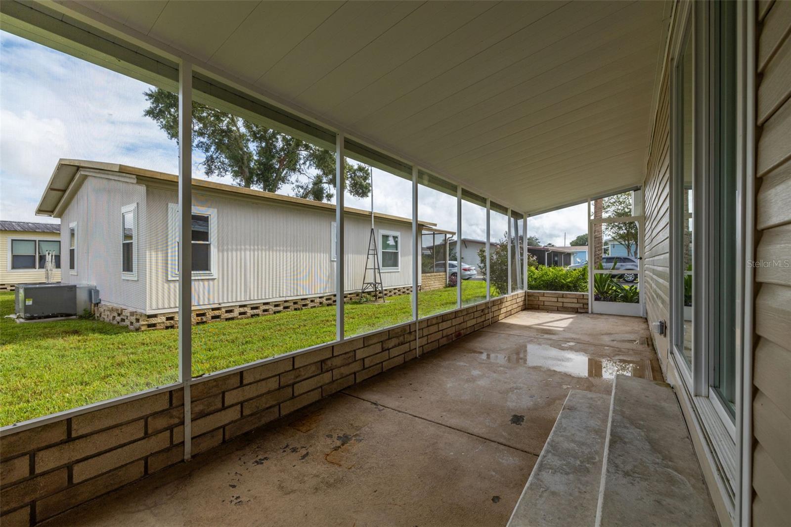 Screened in side porch. Also has a covered/locked storage area.