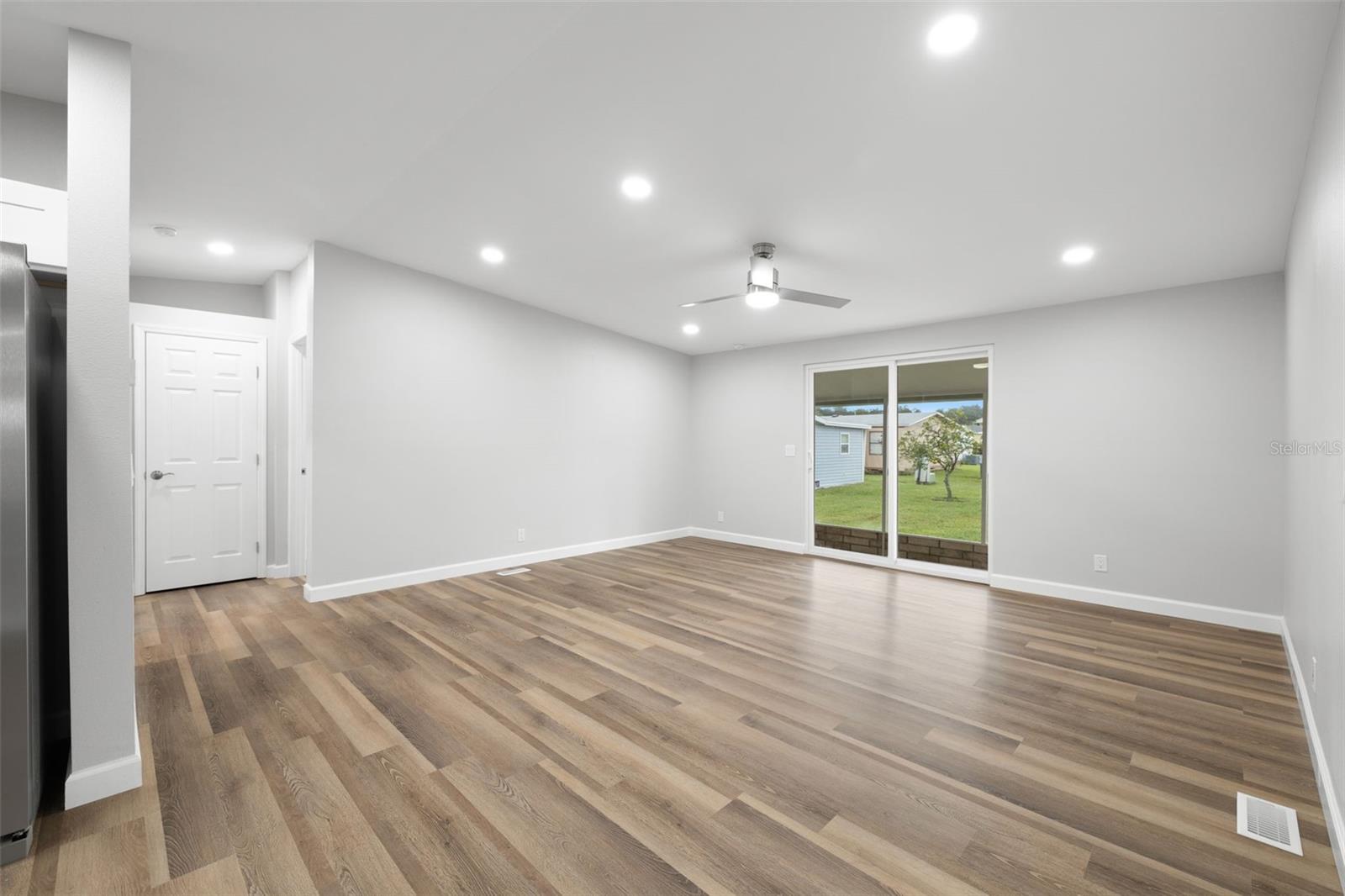 Open Concept Living room!  Look at all the new recessed lighting and drywall throughout the entire home!