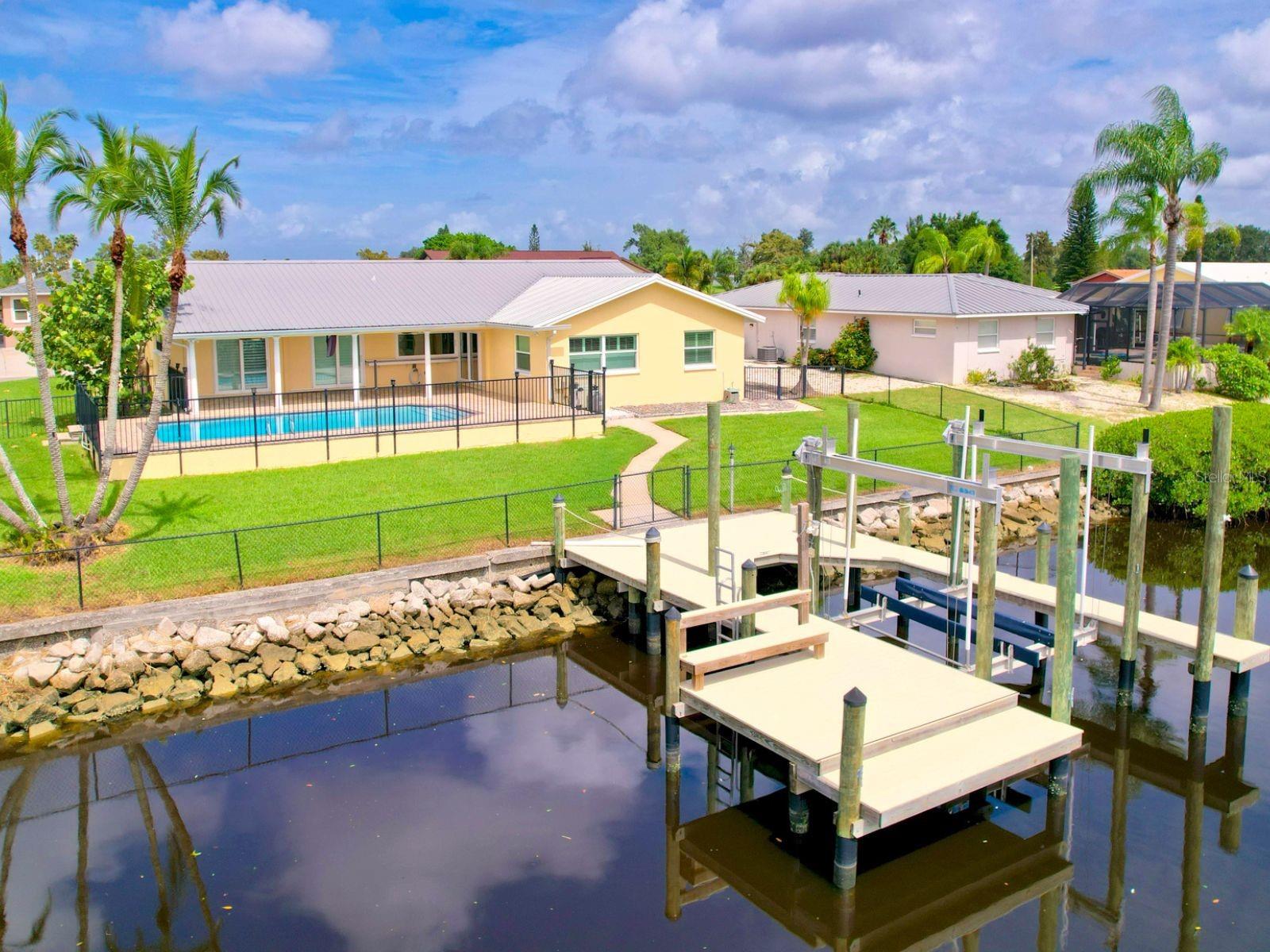 Laid back Apollo Beach living with 100 feet of direct Bay and Gulf access with no fixed bridges, perfect for boating enthusiasts.