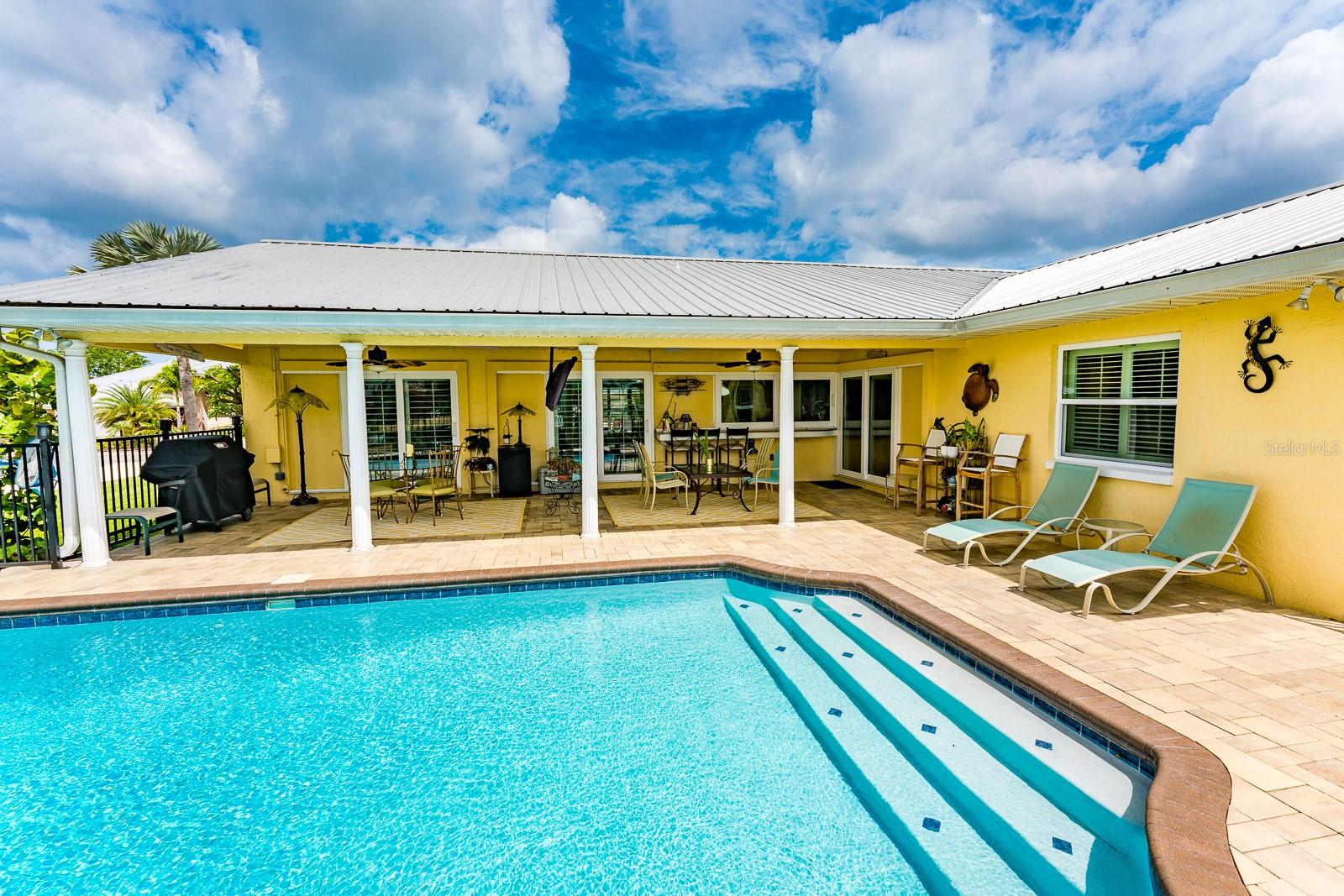 Salt water pool and spacious covered porch for entertaining.