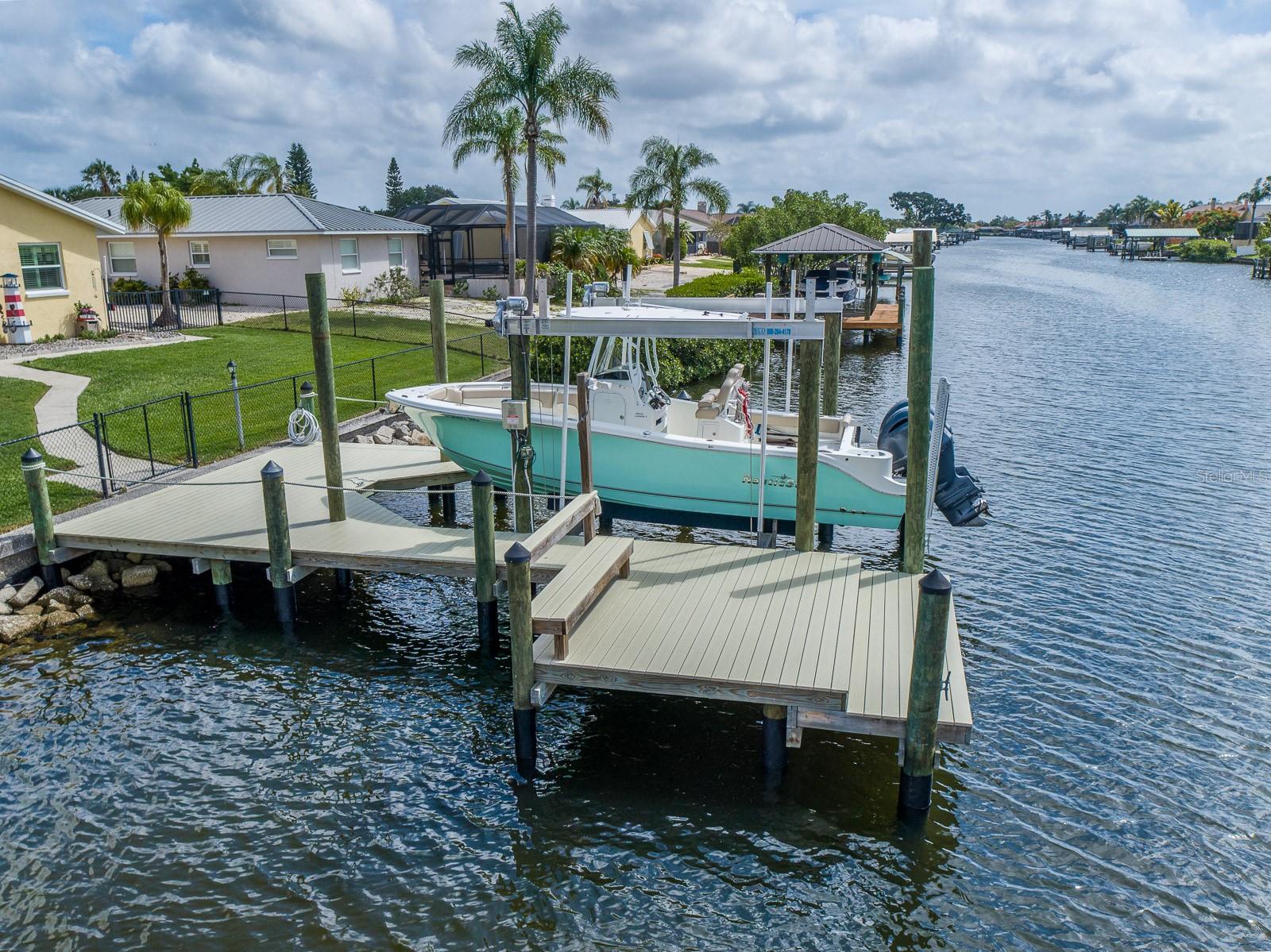 Composite dock with electric and water.  Boat lift can handle a 13,000 pound boat.