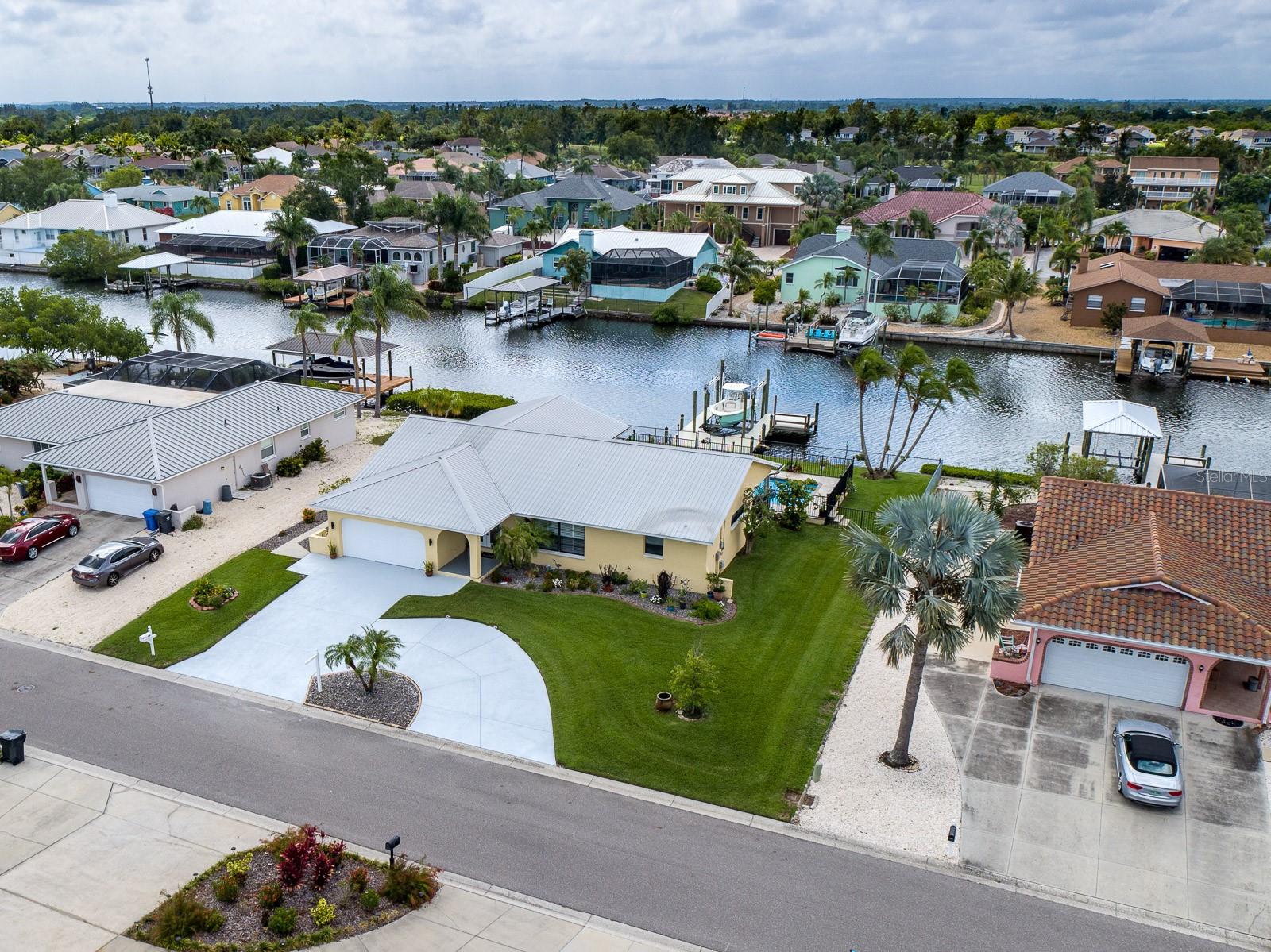 View of canal in back of home leading to the Hillsborough and Tampa Bays and Gulf of Mexico beyond.