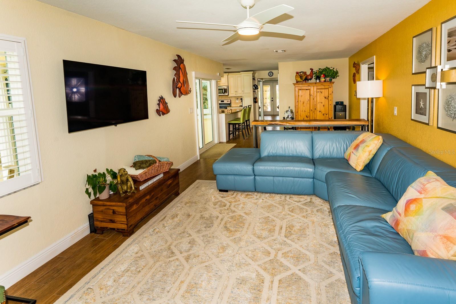 The family room with pocket sliding door to pool and patio is 26' x 12'.