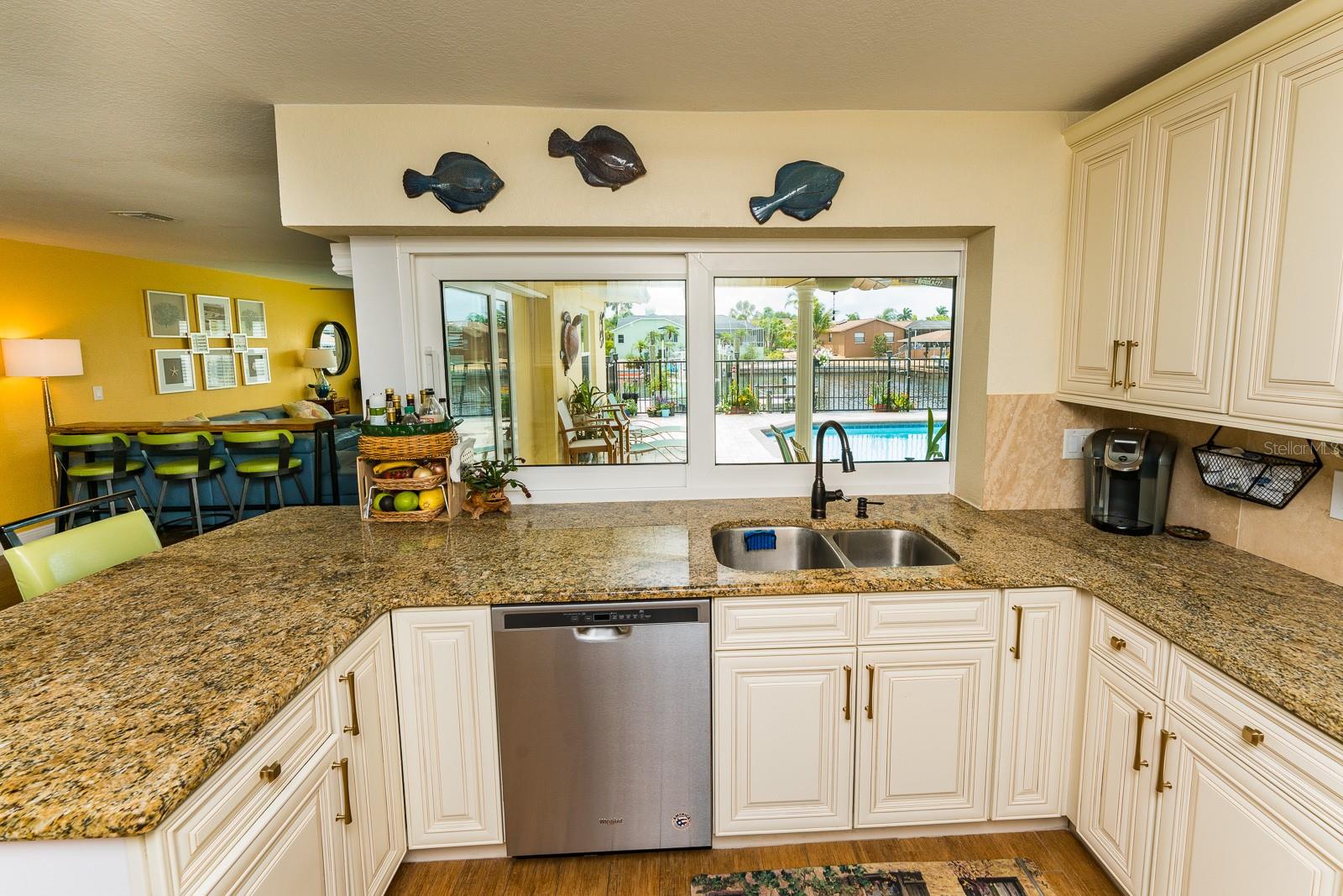 The kitchen has plenty of storage, granite counters and stainless steel appliances.