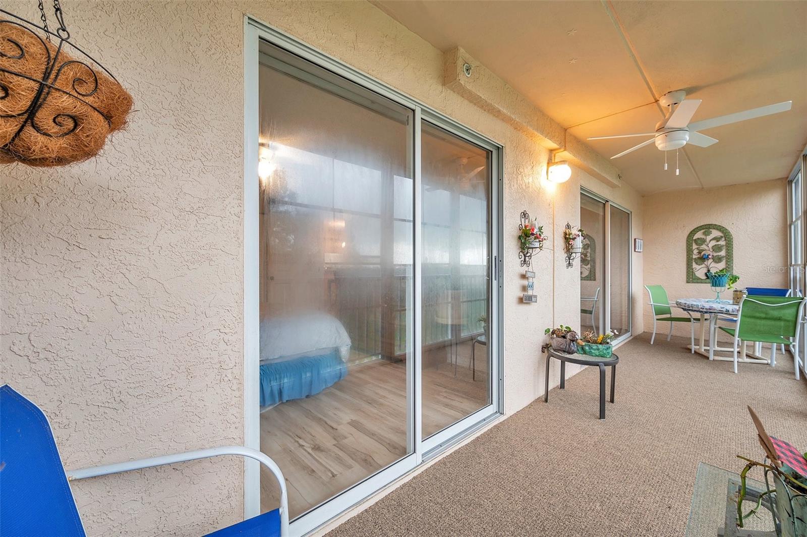 view of the nature preserve from living room, primary bedroom and balcony.