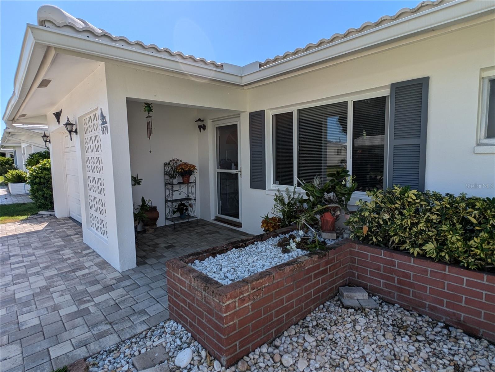 Pavered front entry welcomes friends and family into this charming home.