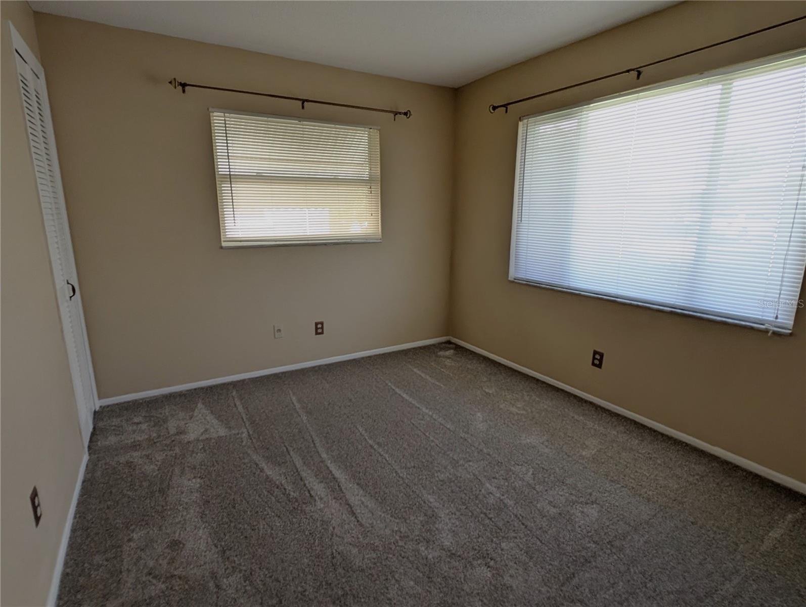 Guest bedroom is next to the guest bathroom.