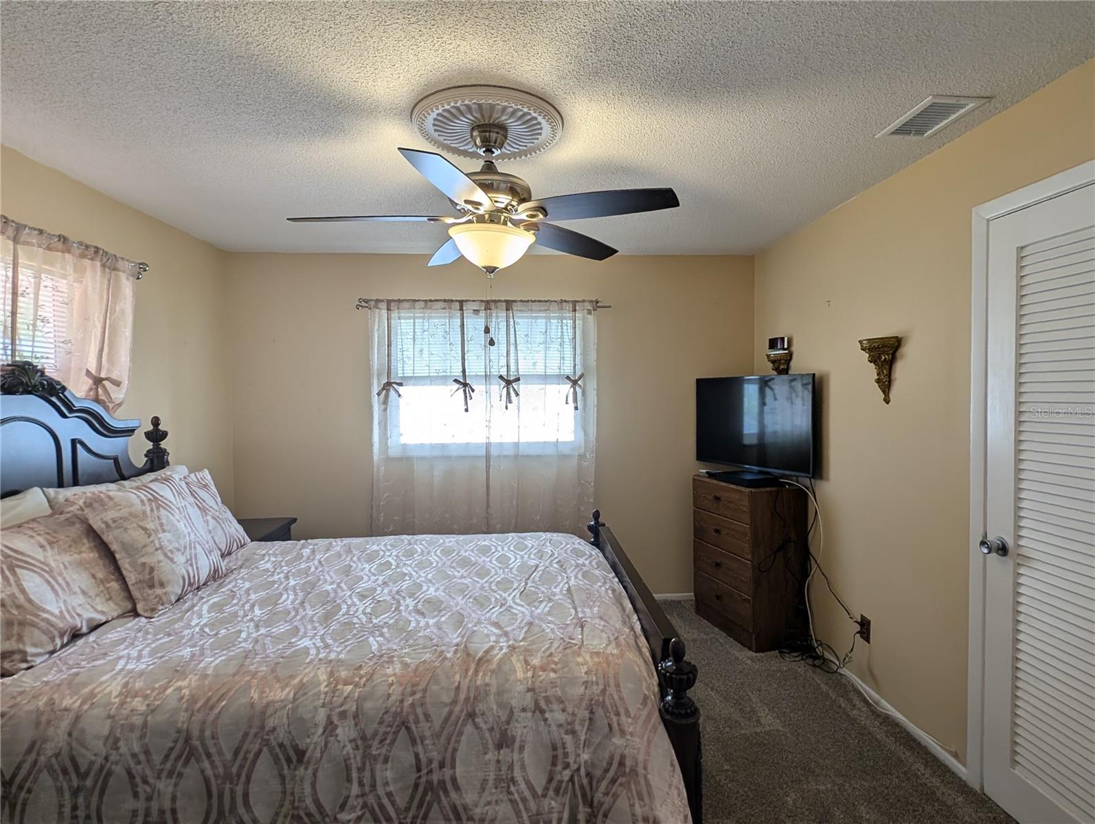 View into primary bedroom.  Closet to right.