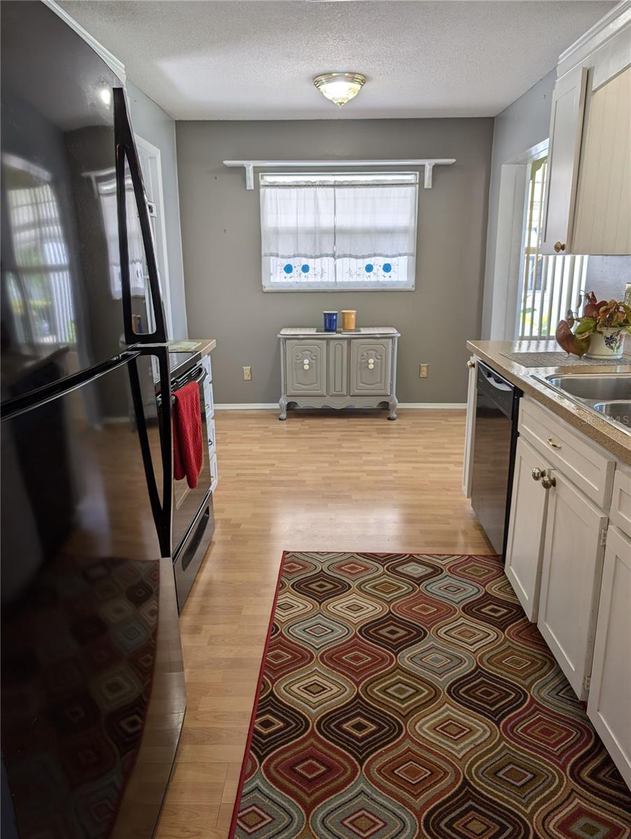 View thru kitchen...garage entry on left, Florida room on right.