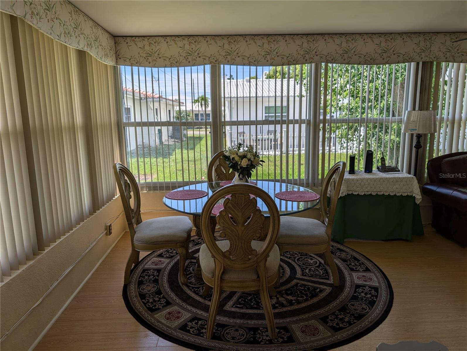 Corner of Florida room utilited as dining area.  View of backyard.