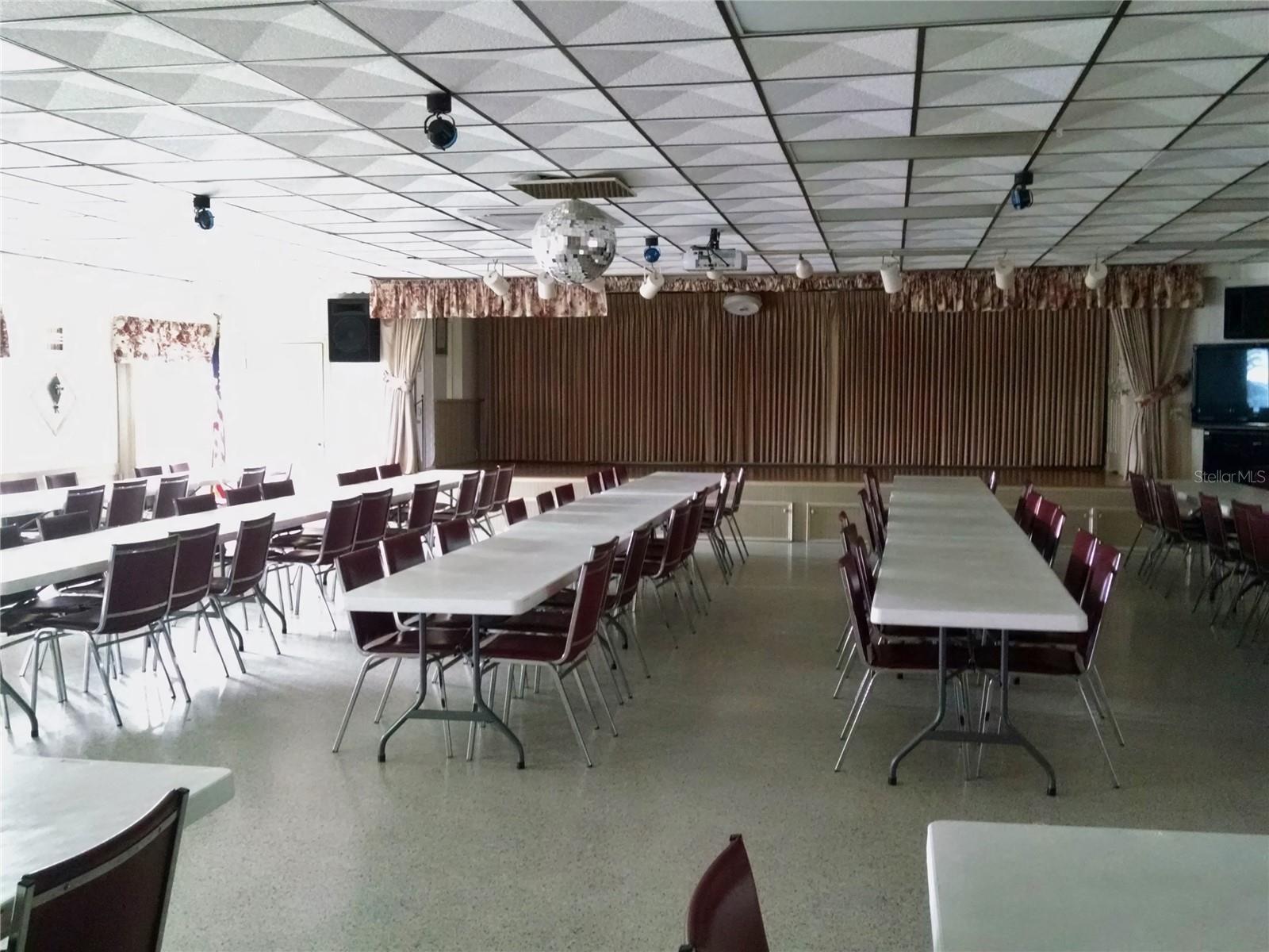 Stage area for live entertainment and community meetings.