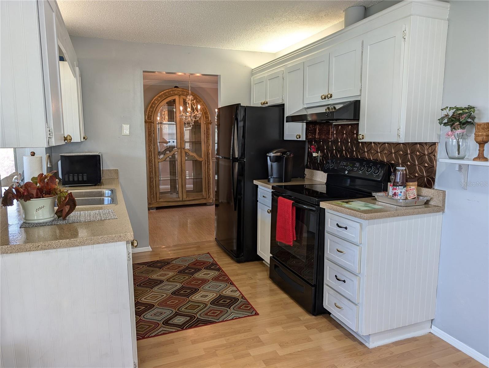 Galley kitchen is adjacent to the dining area.