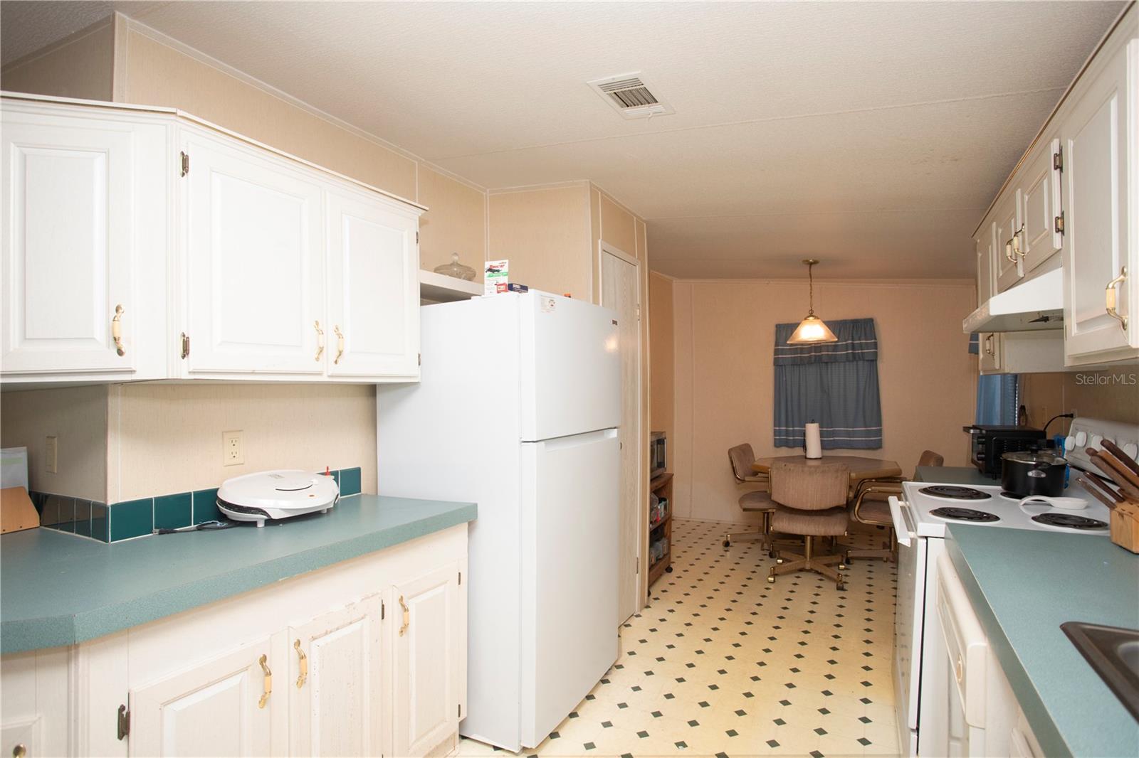 Eating nook in the back leads to laundry room