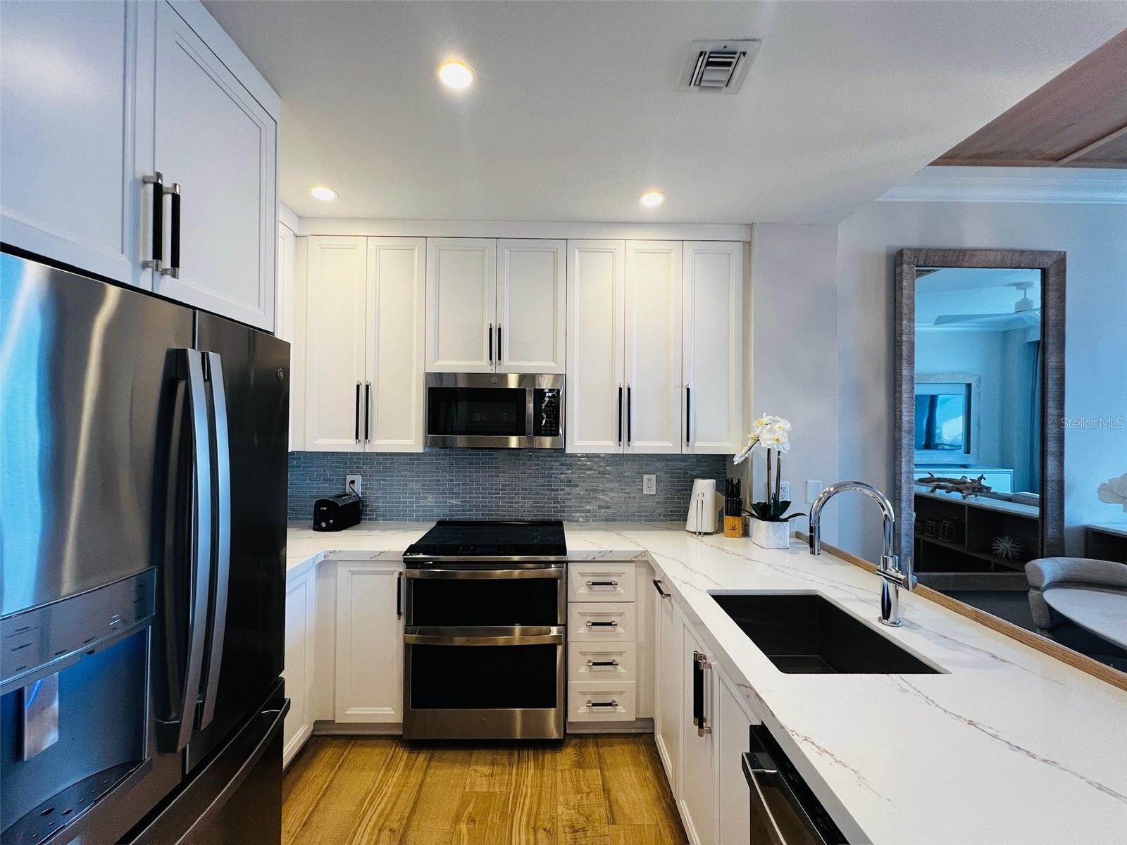 Beautifully updated kitchen equipped with all your cooking needs.