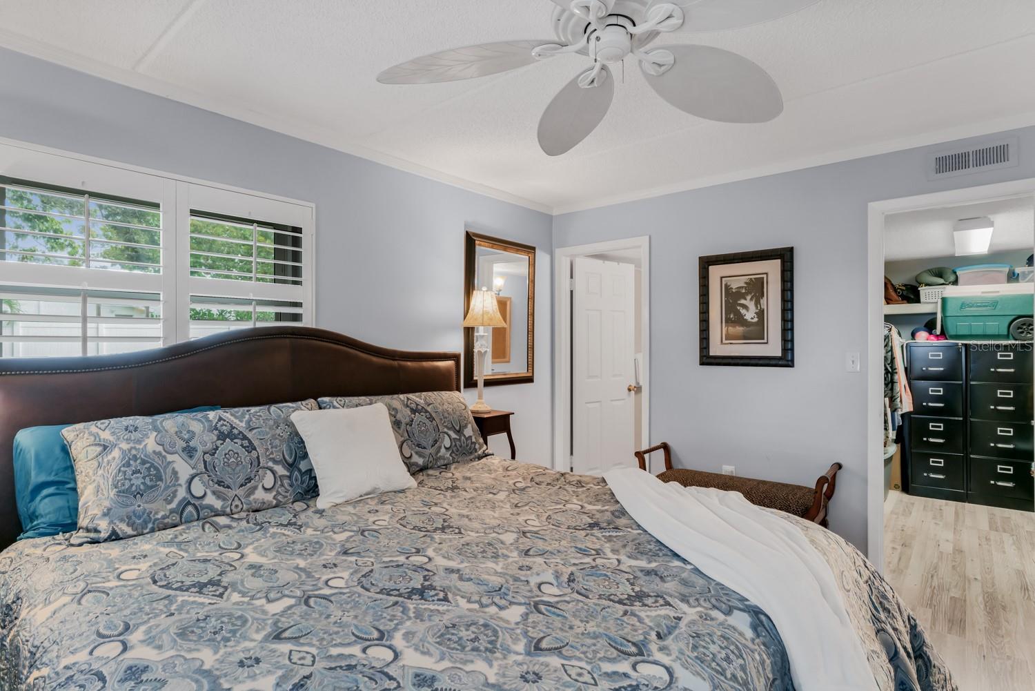 Primary bedroom with ensuite bathroom and walk in closet