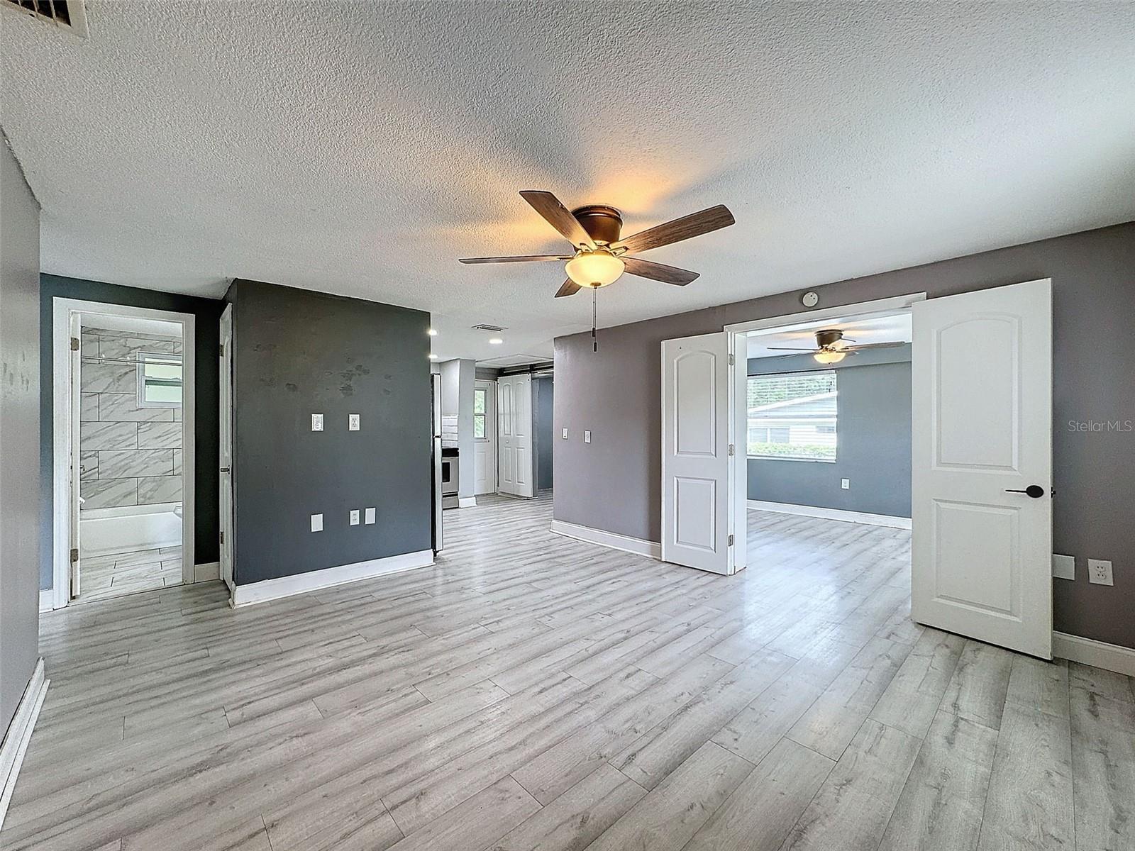 Living Area with Double Doors leading to primary bedroom