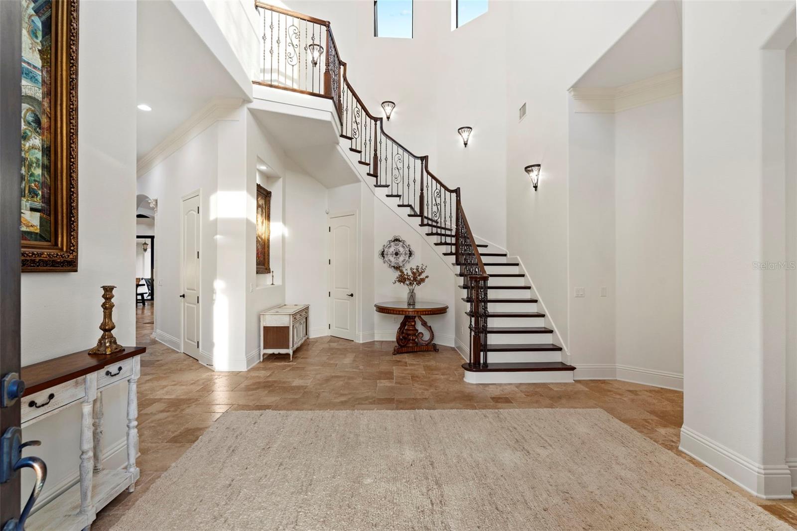 Foyer with spiral staircase.