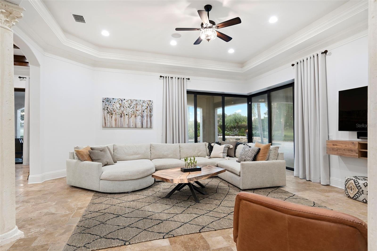 Great Room with sliding glass doors out to pool area.