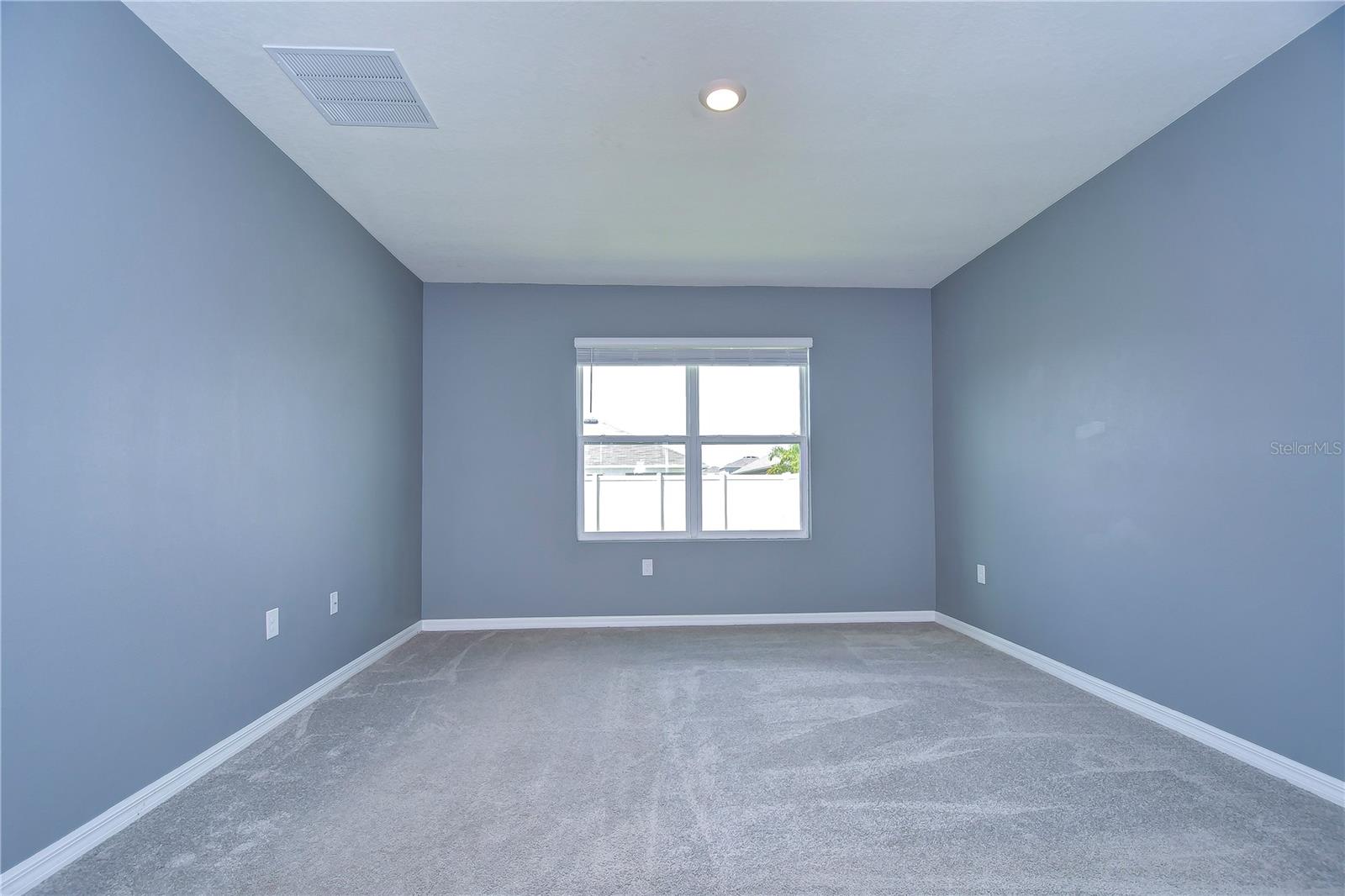 Large windows is complete with a generous walk-in closet!