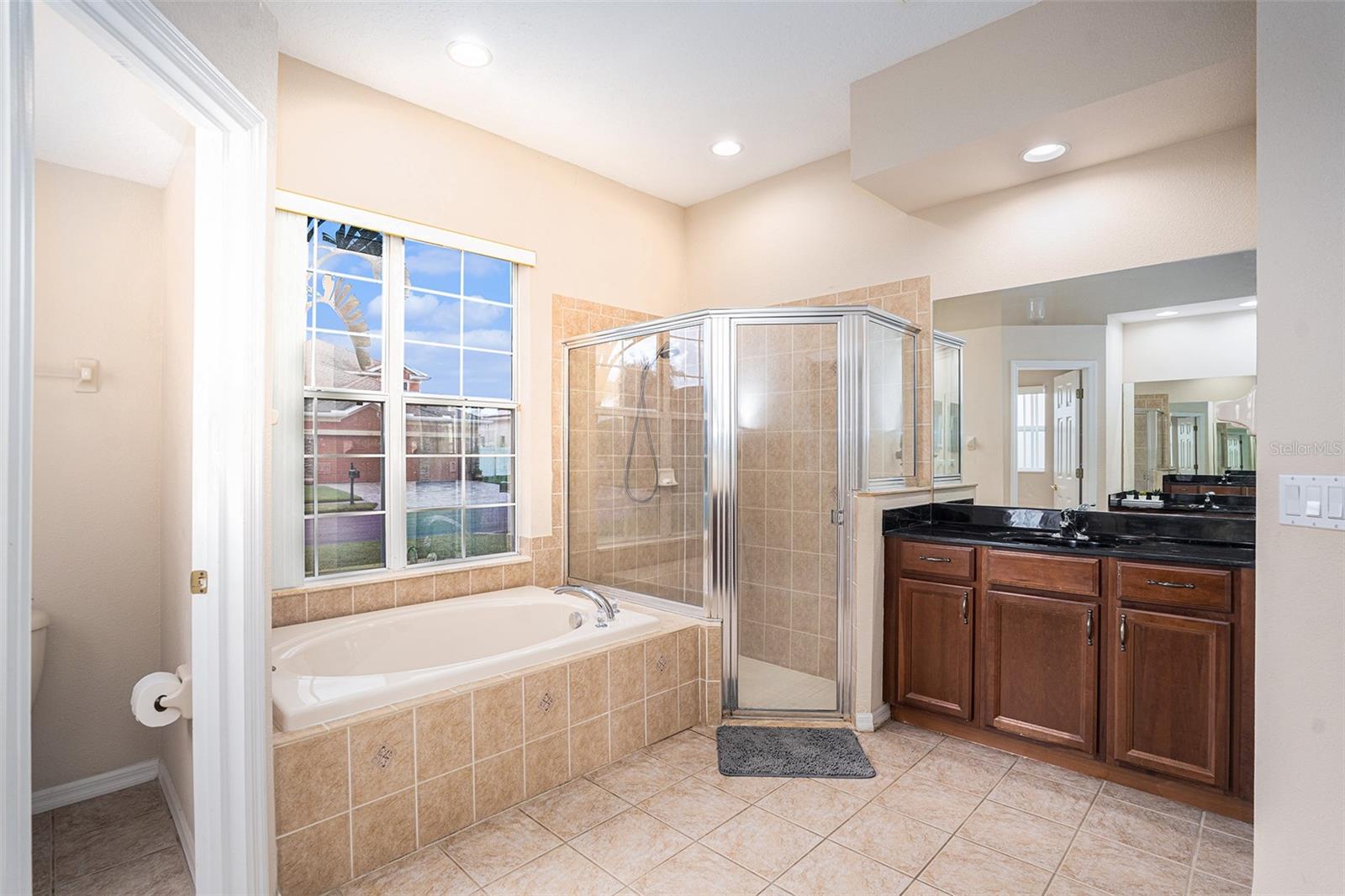 The master bath has dual vanities, and a gorgeous garden tub.