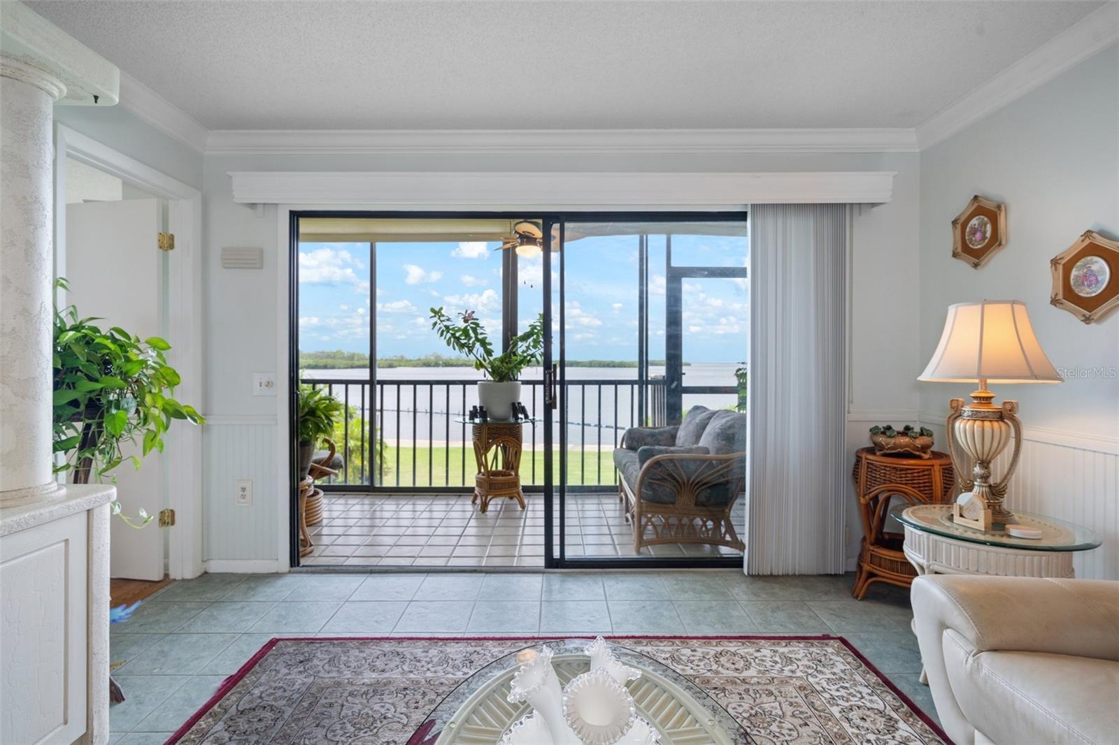 Sliding door access to enclosed lanai direct view of GULF and POOL and BEACH