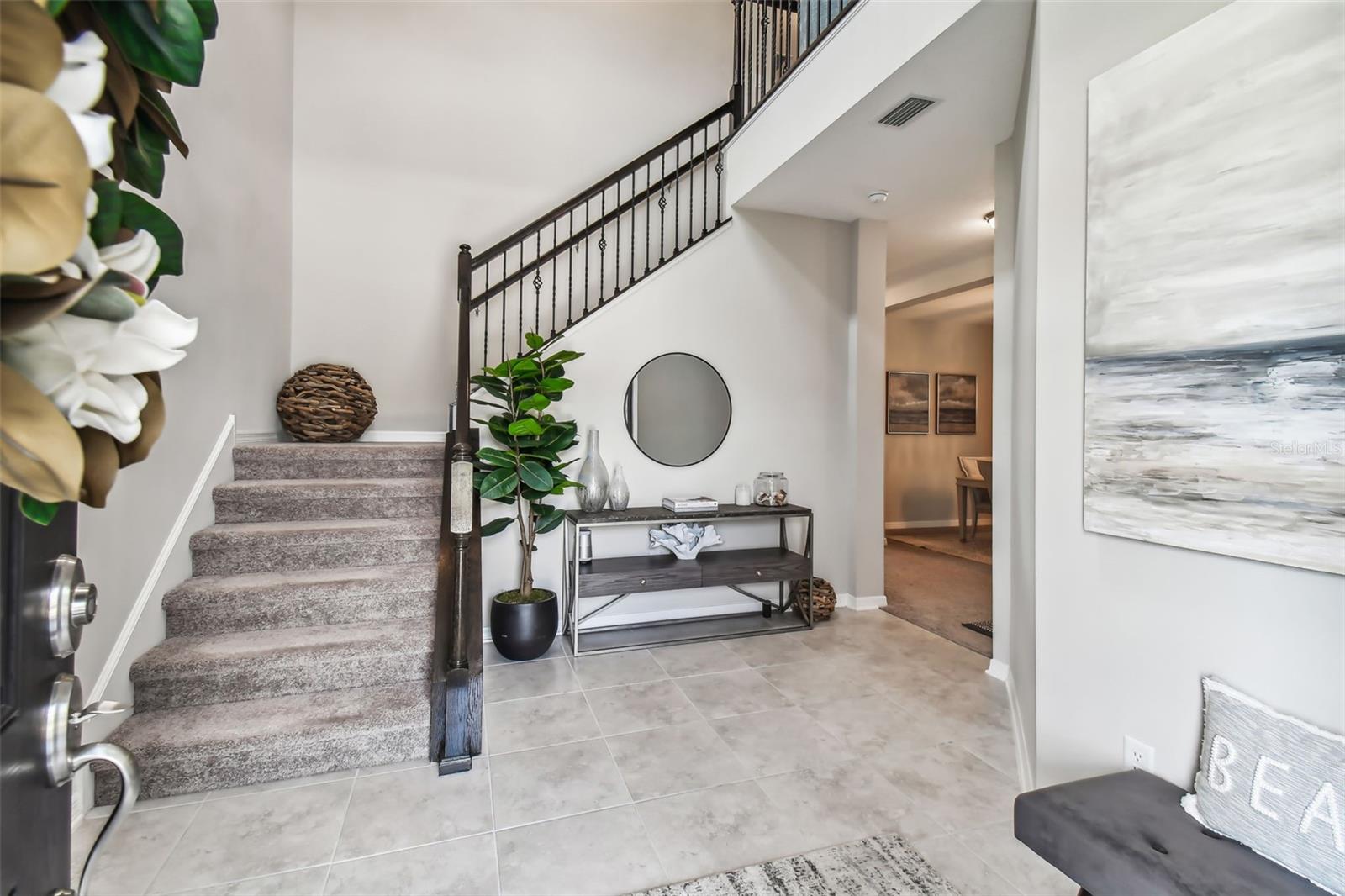 Kitchen includes upgraded Samsung appliances, backsplash and lovely pendant lighting