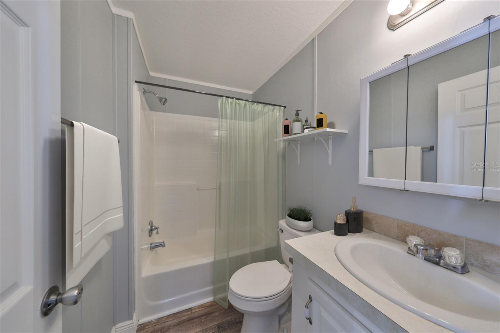 Virtually staged guest bathroom.