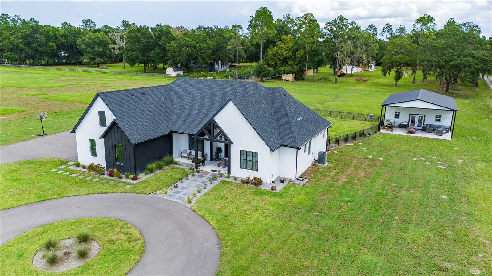 Full Elevated View with Storage Barn and Fenced Yard View