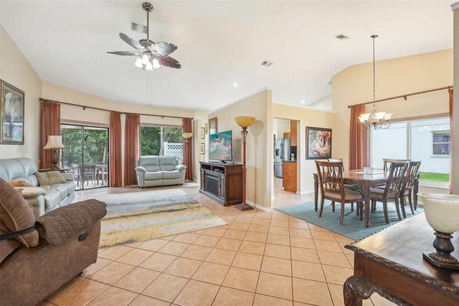 View of open living and dining space from entry