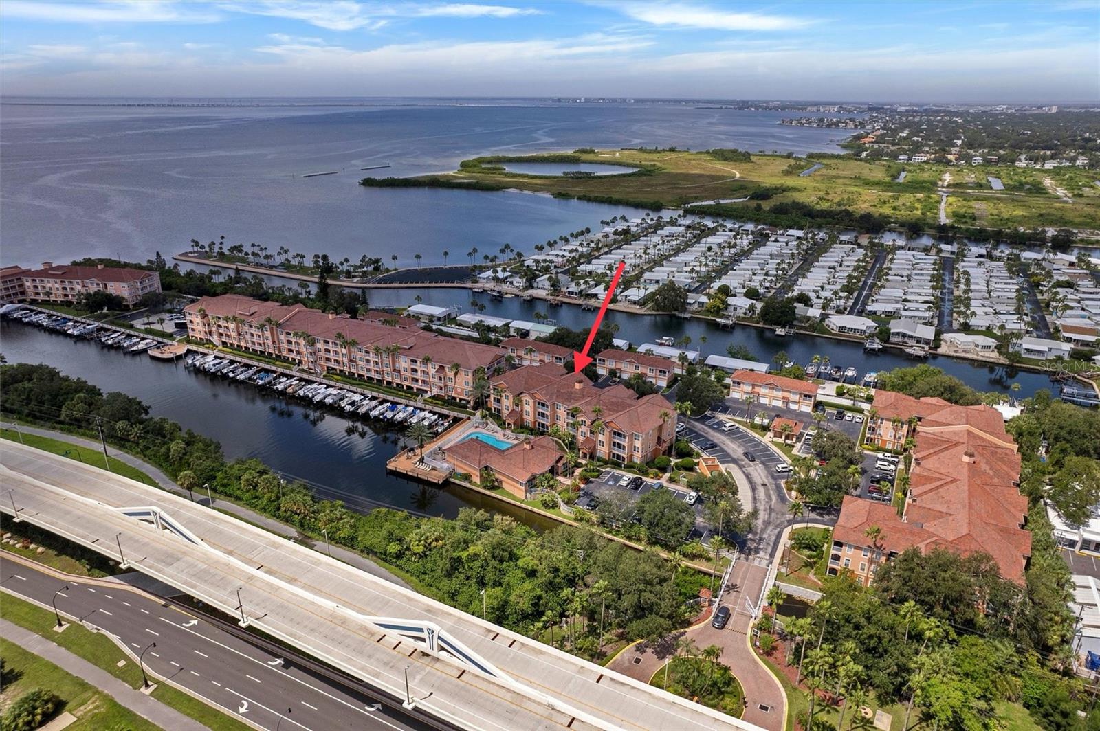 A boardwalk leads to the boat marina with community deck for grilling..