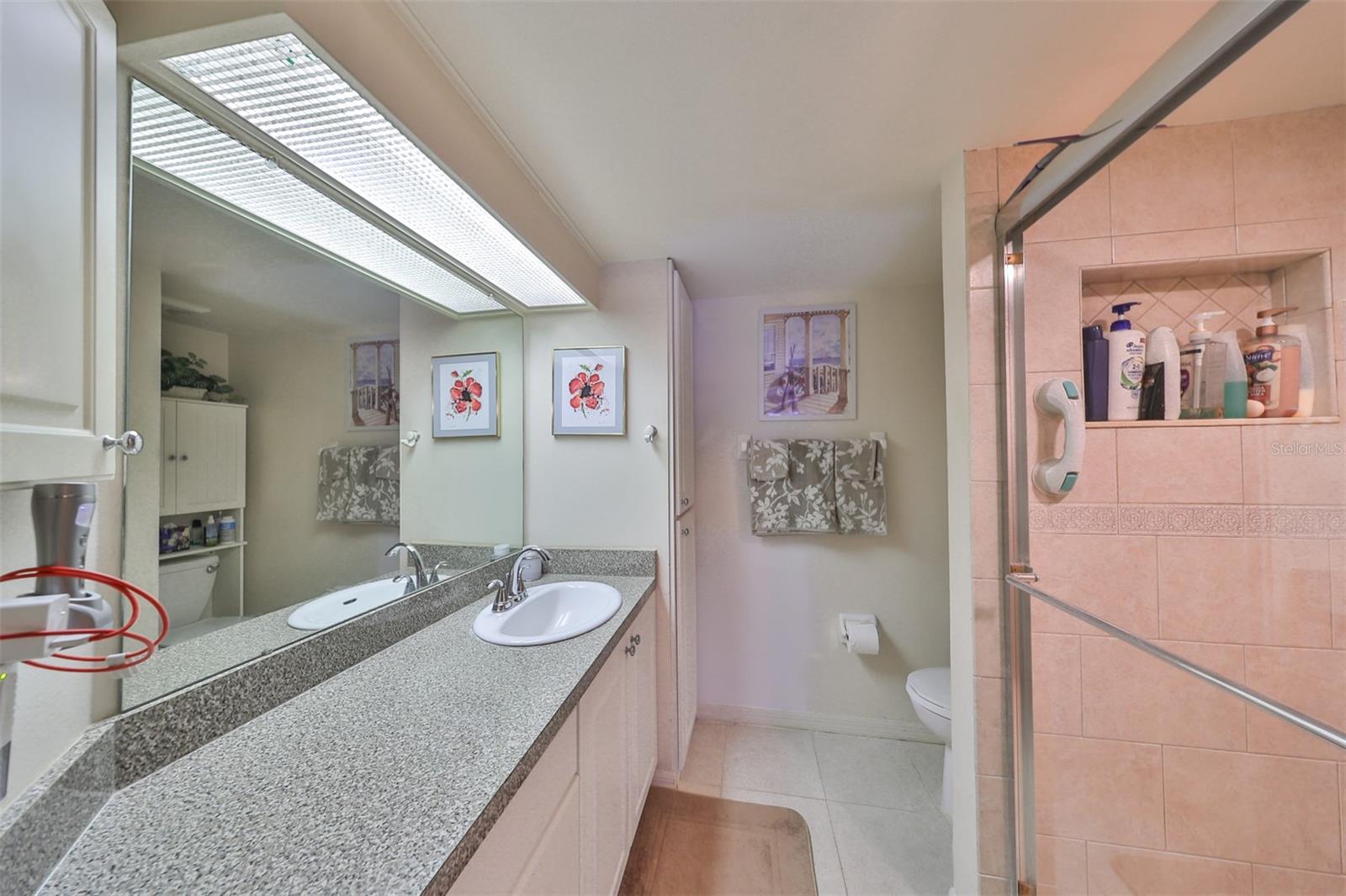 Primary ensuite bathroom is large, clean and has lots of storage.